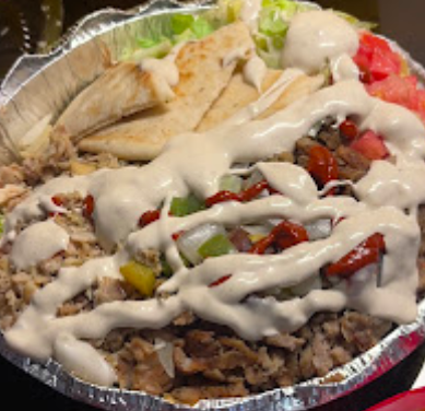 The Halal Guys signature dishes Lamb & Beef Gyro Platter
Seasoned Waffle Fries
White Sauce